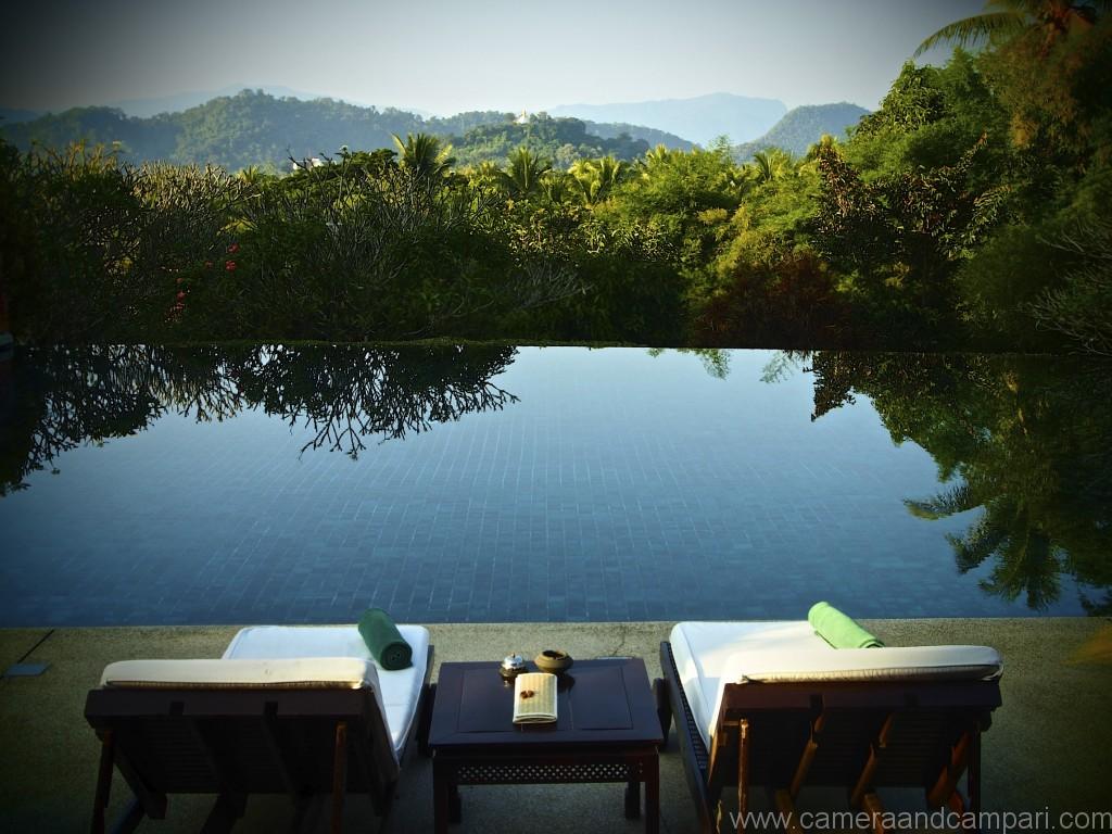 The infinity pool at La residence Phou Vao overlooking the golden temple-crowned Phousi Mountain. 